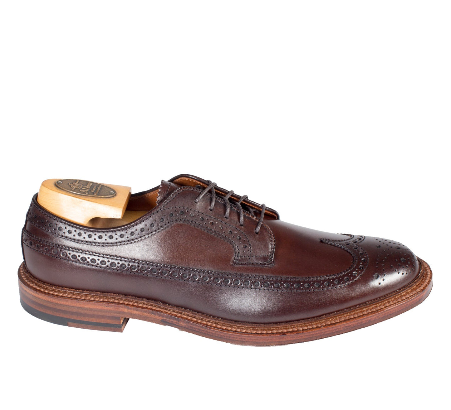 The Alden Madison 976 - Long Wing Blucher in Brown Calfskin features intricate perforations and stitching, a wooden shoe insert, Barrie Last, low heel, and Double Waterlock Sole, all contributing to its classic elegance and polished finish.