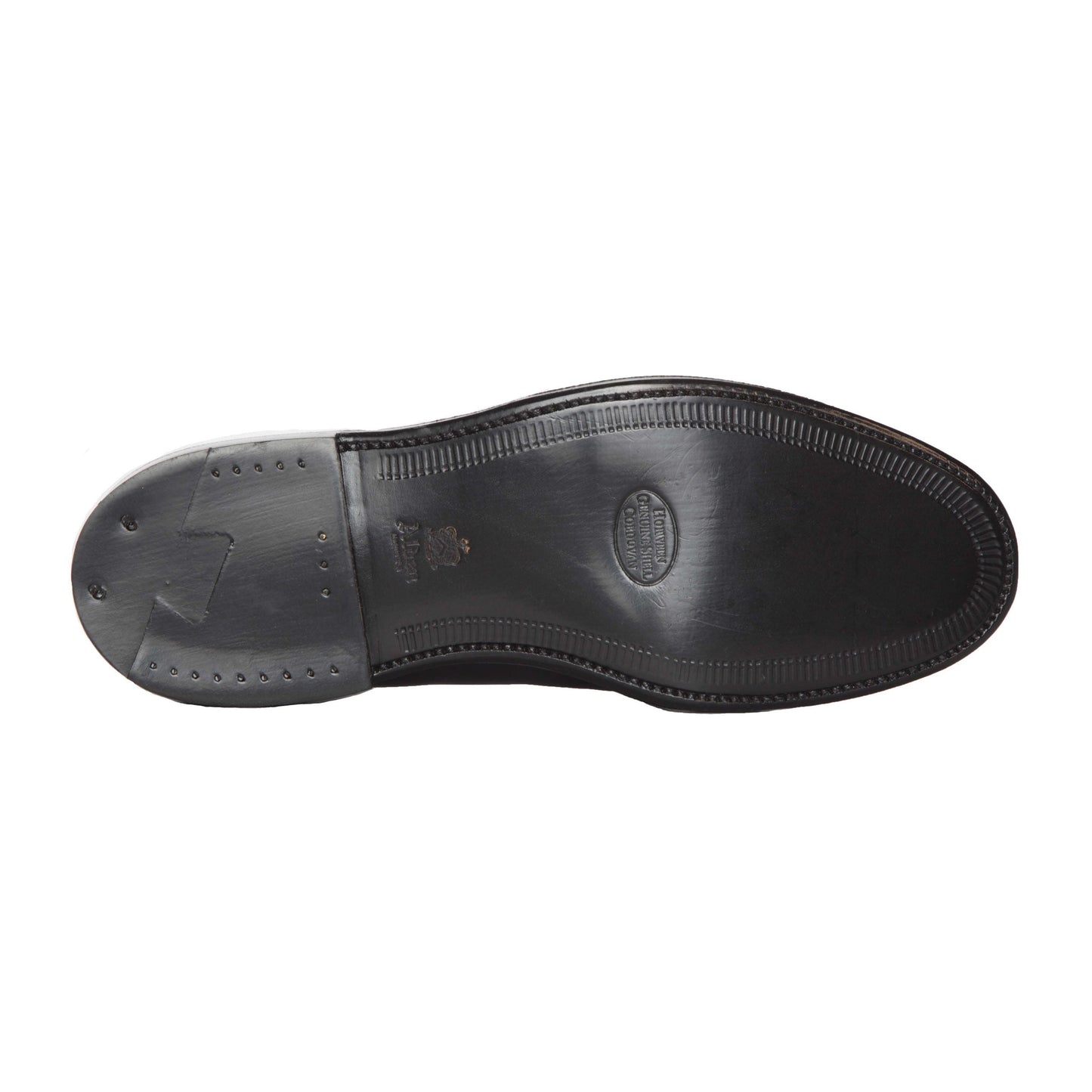 The Alden Madison 67269 - High Vamp Loafer in Black Shell Cordovan features a Single Oak Leather Sole with edge stitching, an oval logo and text at the center, plus small nails near the heel, as seen from the bottom.