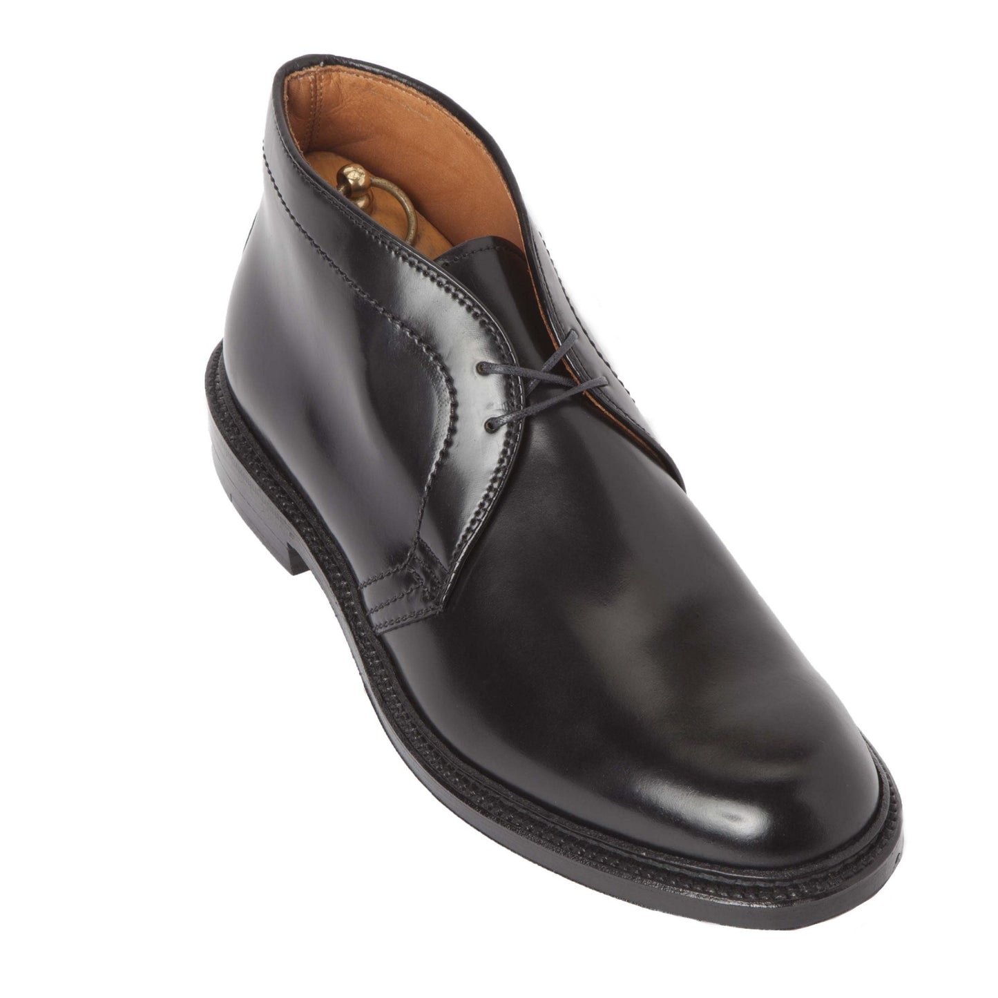 The Alden Madison 1340 - Chukka Boot in Black Shell Cordovan (Deposit) features polished black leather, a sleek design with a Double Oak Leather Sole, black laces, a visible shoe tree for structure, and uses the Barrie Last for a comfortable fit.
