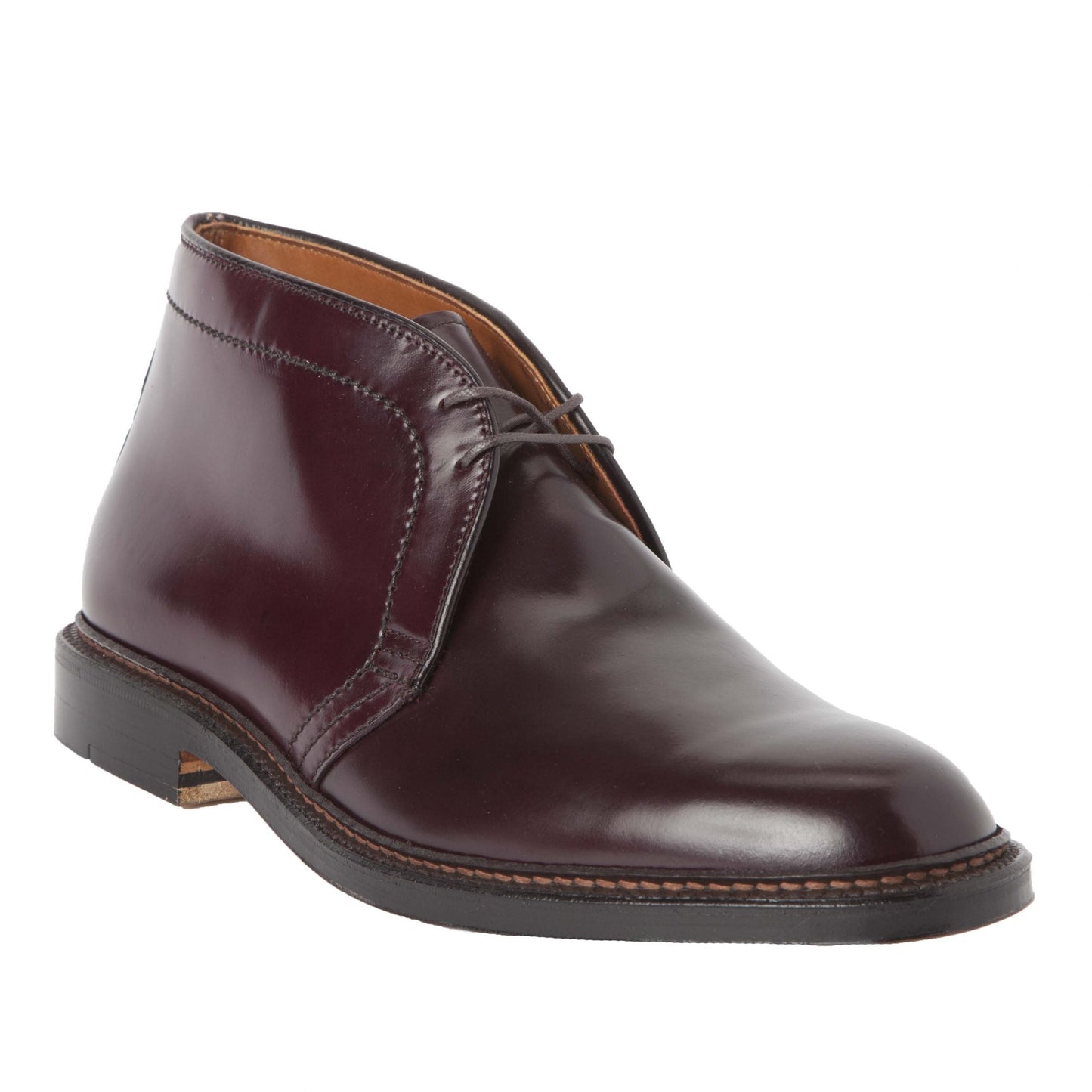 The 1339 Chukka Boot by Alden Madison is crafted in Color 8 Shell Cordovan leather, featuring a polished dark brown finish, minimalist lacing, and a slightly elevated black heel on a classic Barrie Last design.