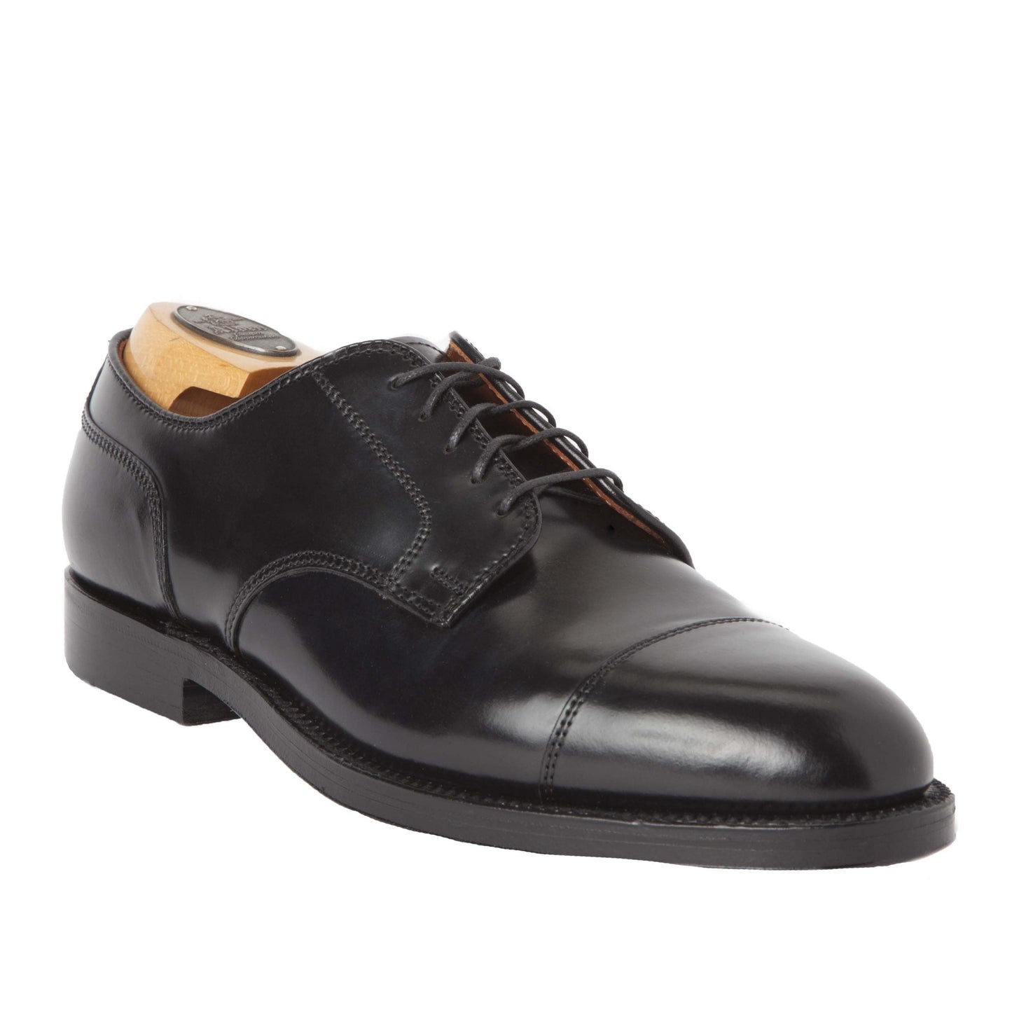 The Alden Madison 2161 - Cap Toe Blucher, made from Black Shell Cordovan and crafted on the Aberdeen Last, features a polished finish with black laces, low heel, and includes a wooden shoe tree. The elegant design sits on a plain white background.