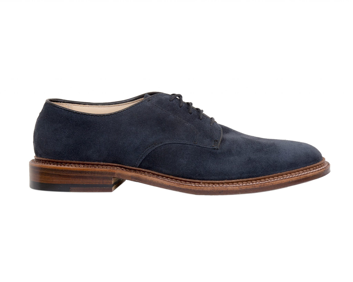 Alden Madisons 29331F Unlined Plain Toe Blucher in navy blue suede features black laces and a sleek brown wooden sole. Showcased in a side profile on a white background, its storm welt design ensures durability, offering both style and practicality.