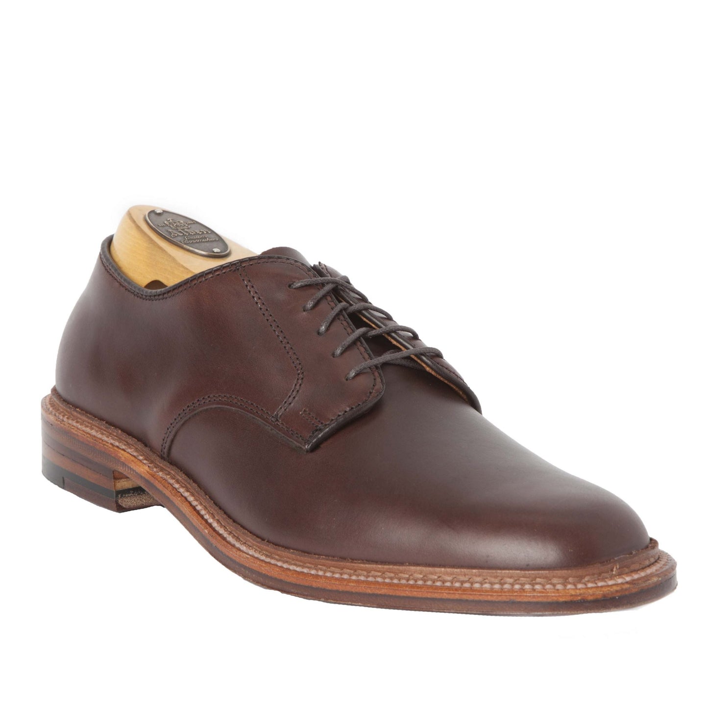 Alden Madison's 29364F Unlined Plain Toe Dover in Brown Chromexcel is a single brown leather lace-up dress shoe, shown with a wooden shoe tree and contrasting sole, shaped on the Barrie Last against a white background.