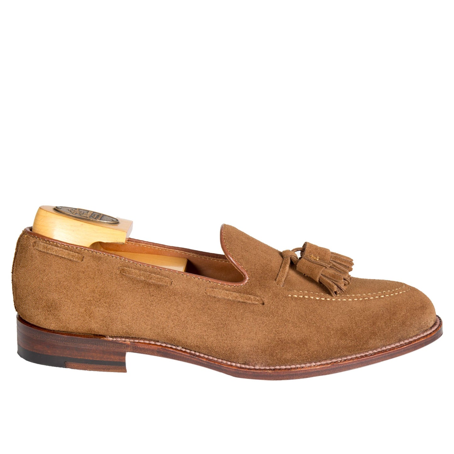 The Alden Madison 3403 Tassel Loafer in Snuff Suede features a leather sole and wooden shoe tree, crafted on the Aberdeen Last. Subtle stitching enhances its classic appeal.