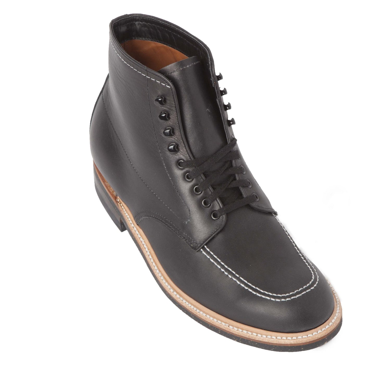 The Alden Madison 401 - Indy Boot in Black Chromexcel features black leather, black laces and eyelets, white stitching on the toe and around the Neoprene cork sole, plus tan and black accents. The boots are shown angled against a white background.