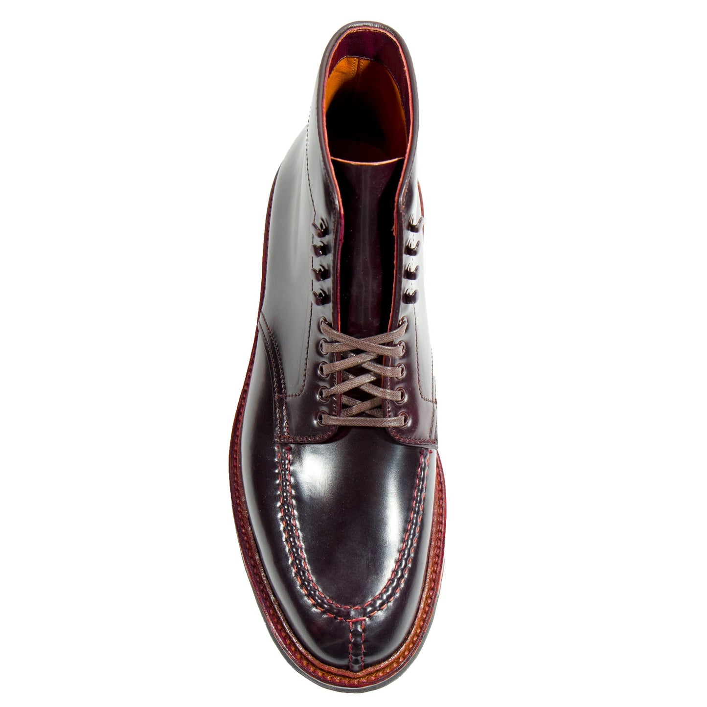 The 40218HC - NST Tanker Boot from Alden Madison features polished dark brown leather, crafted on the Barrie Last with intricate toe cap stitching, brown laces, and a contrasting lighter brown welted sole, all seen from above to highlight its refined elegance.
