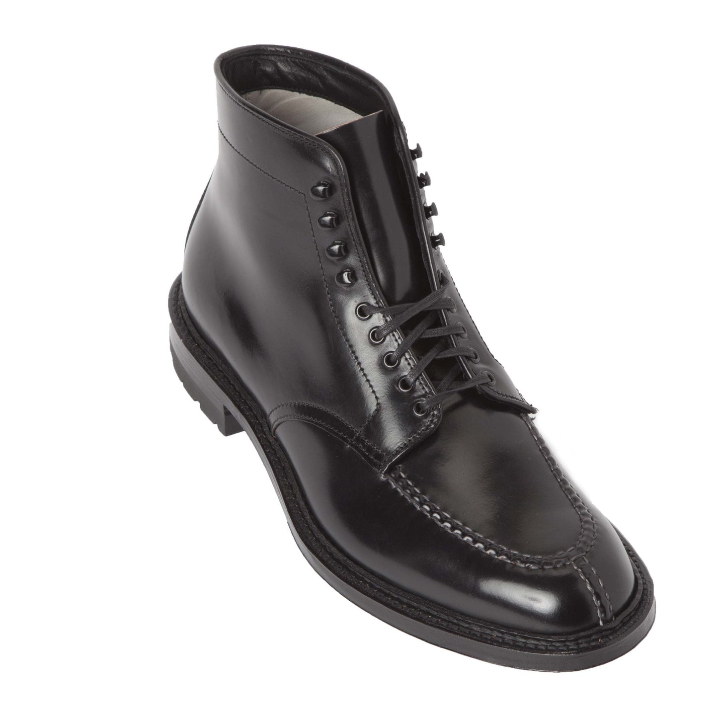 The 40219HC - NST Tanker Boot by Alden Madison is crafted from Black Shell Cordovan leather with a shiny finish, lace-up design, front and side decorative seam, all on the Barrie Last. Its Commando Sole ensures grip and durability for a polished, classic look.