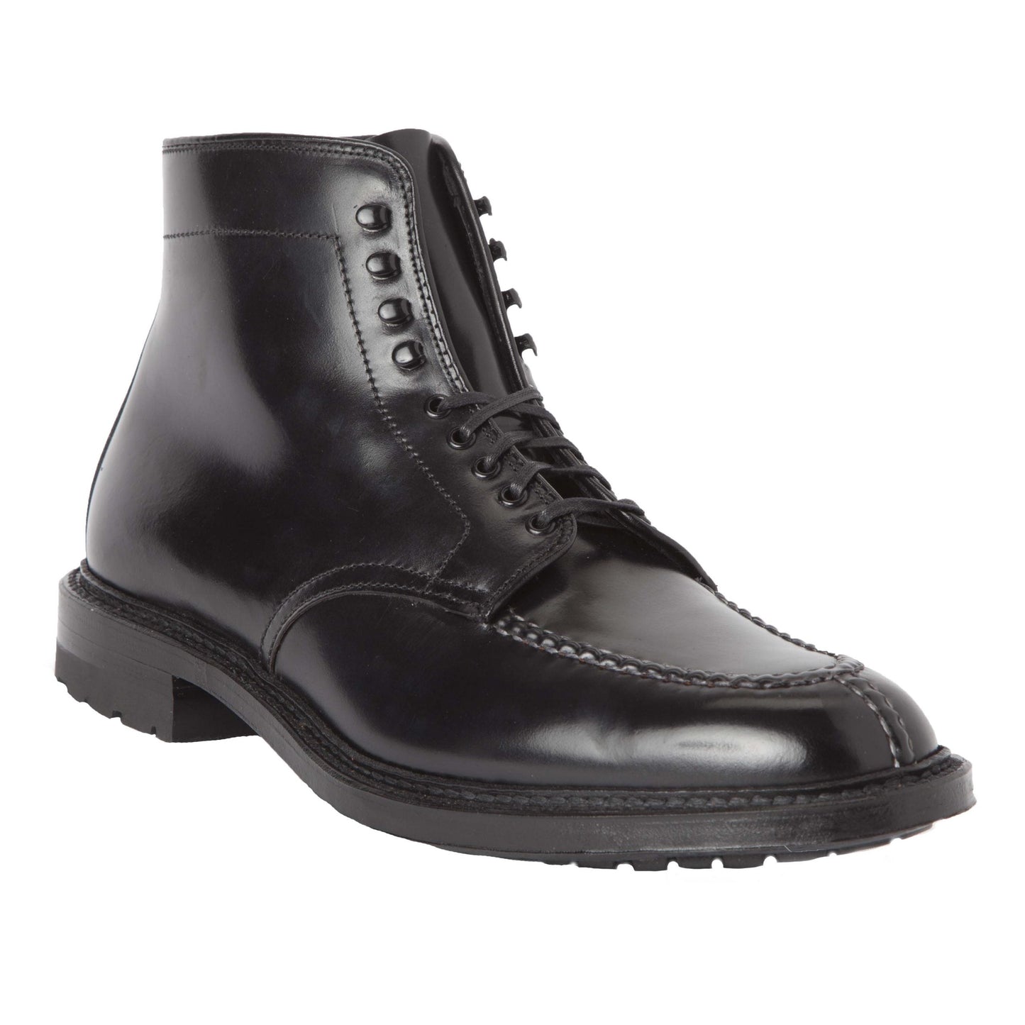 The Alden Madison 40219HC - NST Tanker Boot in Black Shell Cordovan is a polished black ankle boot with detailed front stitching, black laces, and a Commando Sole for grip, crafted on the Barrie Last for a sleek design.