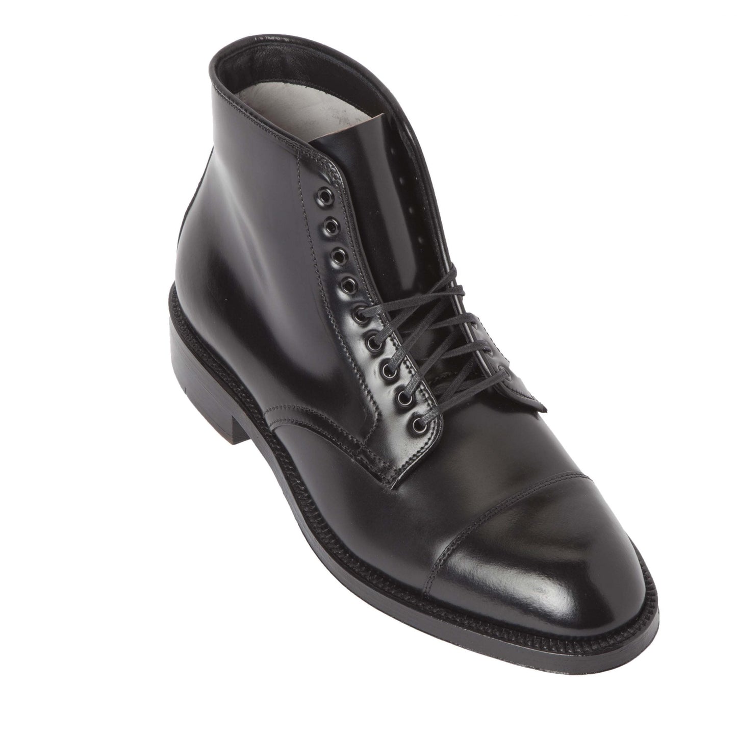 The Alden Madison 4065 - Cap Toe Boot in Black Shell Cordovan features a sleek design with laces on the Grant Last, a cap toe, and a durable Double Oak Leather Sole. Its polished finish highlights its formal elegance, making it ideal for any occasion.