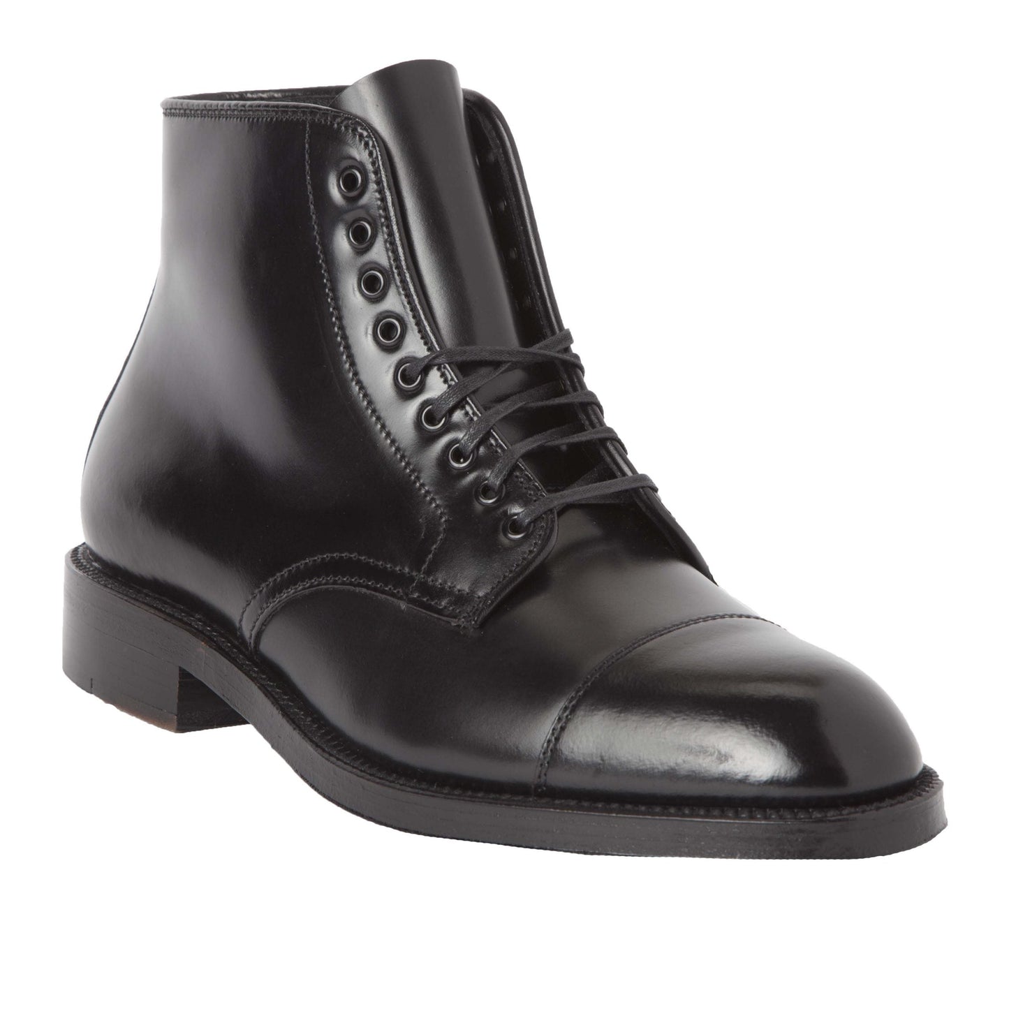 The Alden Madison 4065 Cap Toe Boot in Black Shell Cordovan, seen from a slight side angle, showcases its polished finish with eyelets for laces, a cap toe, and a low heel on a Double Oak Leather Sole, emphasizing its sleek and formal design.