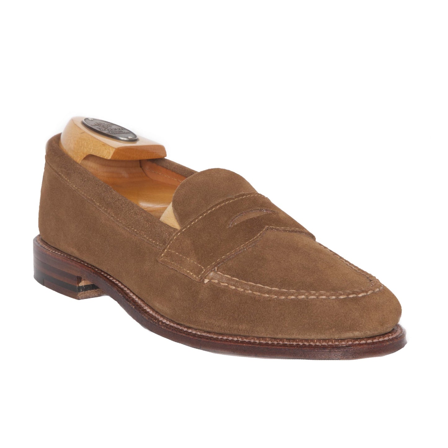 The Alden Madison 6243F Unlined Leisure Hand Sewn loafer in Snuff Suede is showcased against a plain white background, featuring a rounded toe, hand-stitched detailing, visible stitching, a low wooden heel, and a wooden shoe tree inserted.