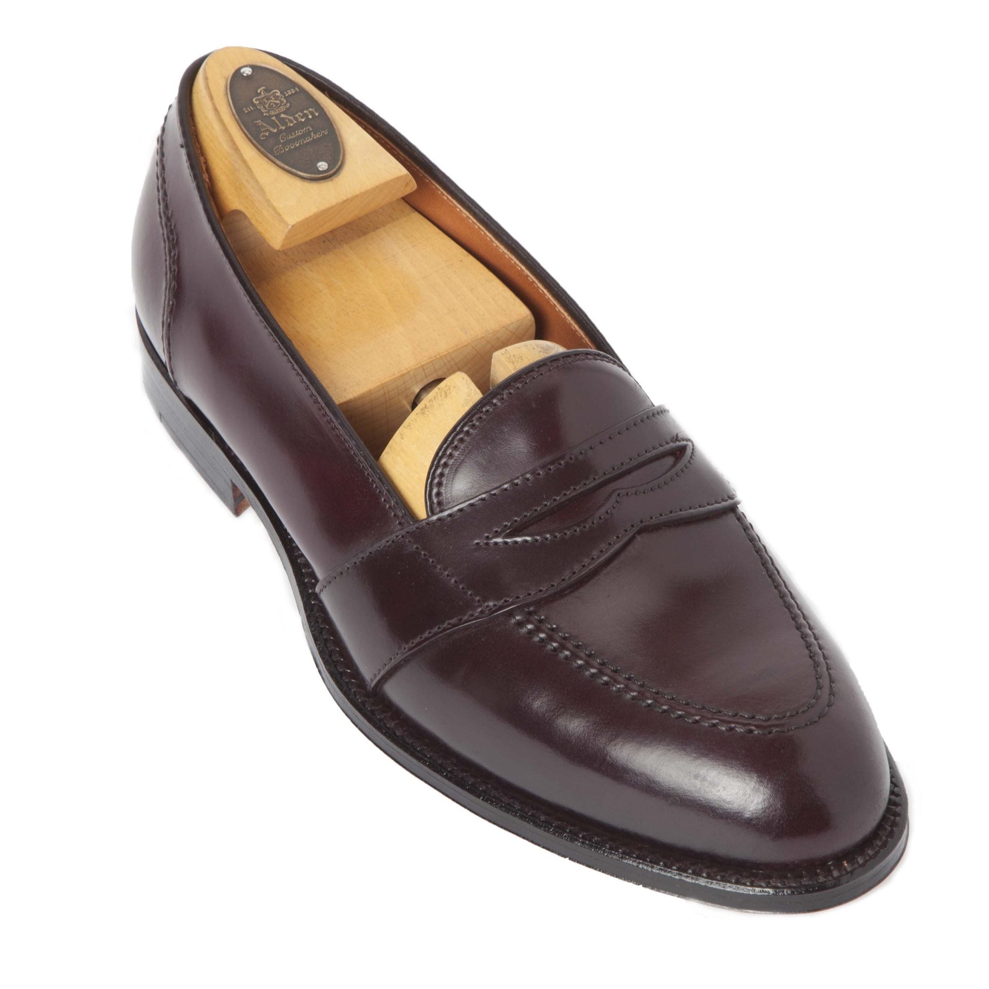 The Alden Madison 684 - Full Strap Loafer in Color 8 Shell features a dark brown Shell Cordovan leather with visible stitching, a wooden shoe tree, low heel on the Aberdeen Last, polished finish, and durable leather outsole.