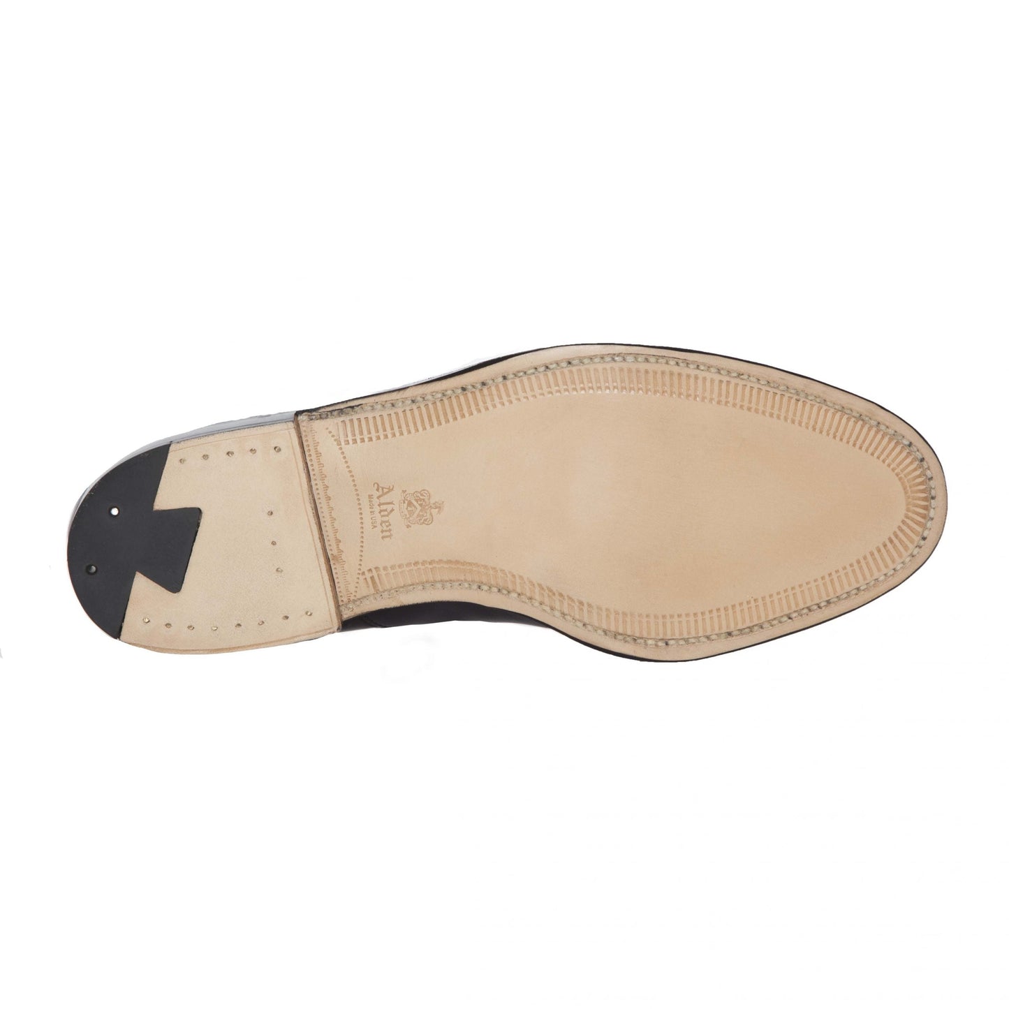 The image displays the sole of Alden Madisons 67169 - High Vamp Loafer in Color 8 Shell. The tan sole has hand stitching along the edge, a small black rubber heel with metal reinforcements, and the brand name is embossed near the arch.