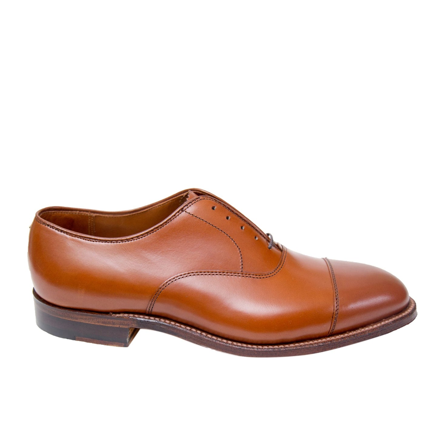 The Alden Madison 9062 - Straight Tip Bal showcases a classic Oxford design with burnished tan calfskin, closed lacing, and a cap toe on a dark brown sole, set against a white background.