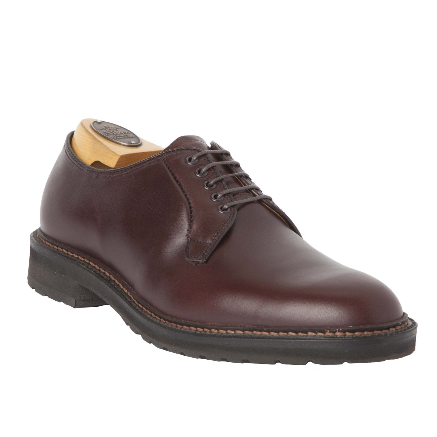 The Alden Madison 9432S, a Plain Toe Blucher in Brown Chromexcel, features a classic lace-up design on the Barrie last with a chunky lug rubber sole and wooden shoe tree for perfect structure, elegantly angled to the right.