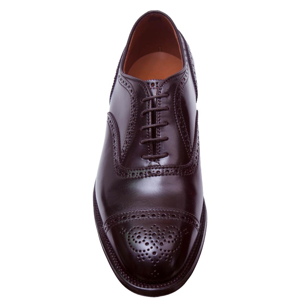 Alden Madison’s 9854 – Medallion Cap Toe Bal in Color 8 Shell Cordovan, shown from above, features visible laces, decorative perforations on the toe cap and seams, and is crafted on the Hampton Last with a leather sole.