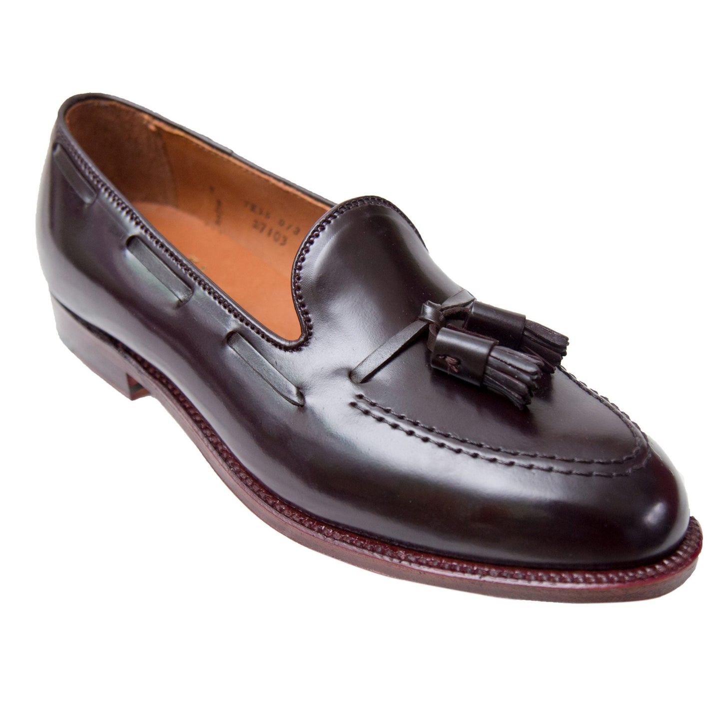 The Alden Madison D7103 - Antique Tassel Loafer is crafted from Color 8 Shell Cordovan, featuring detailed stitching, a low heel, and antique edging for a formal look on the Aberdeen Last.