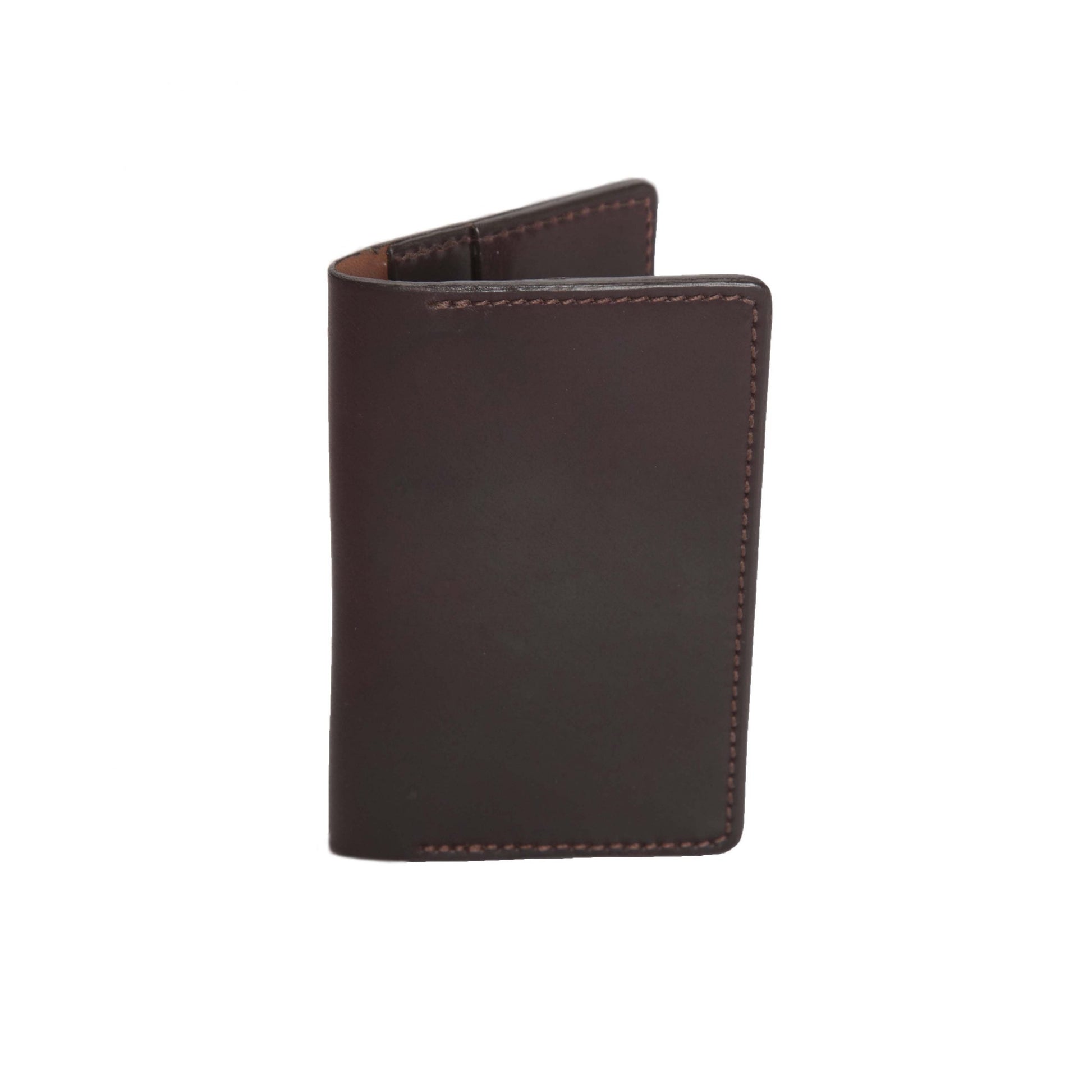 The Alden Madison Credit Card Wallet in Shell Cordovan, a closed dark brown leather wallet, stands upright on a white background. It highlights its smooth texture, edge stitching, and a sleek single-fold design featuring 4 slots.