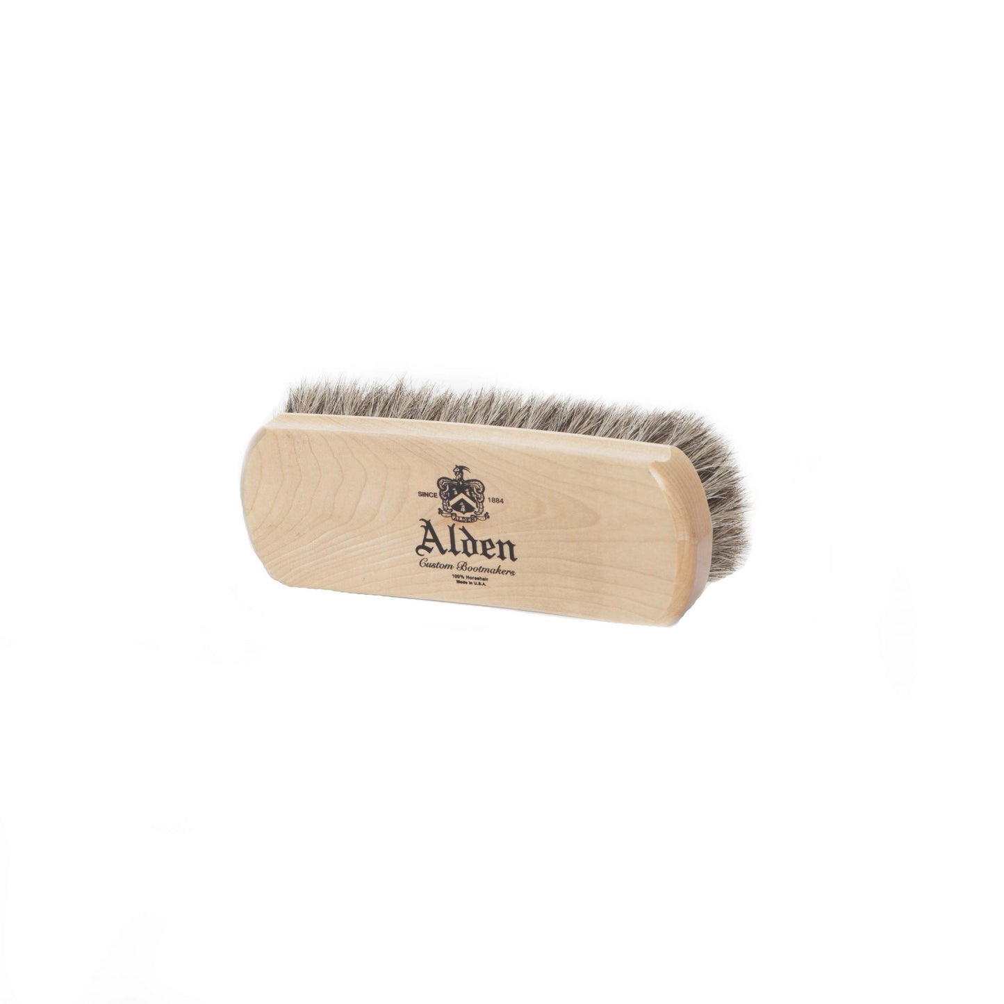 The Horse Hair Brush (Small) from Alden Madison showcases a sleek wooden handle with natural horse hair bristles and the Alden logo. Made in USA, this essential accessory is presented against a plain white background, highlighting its refined design.