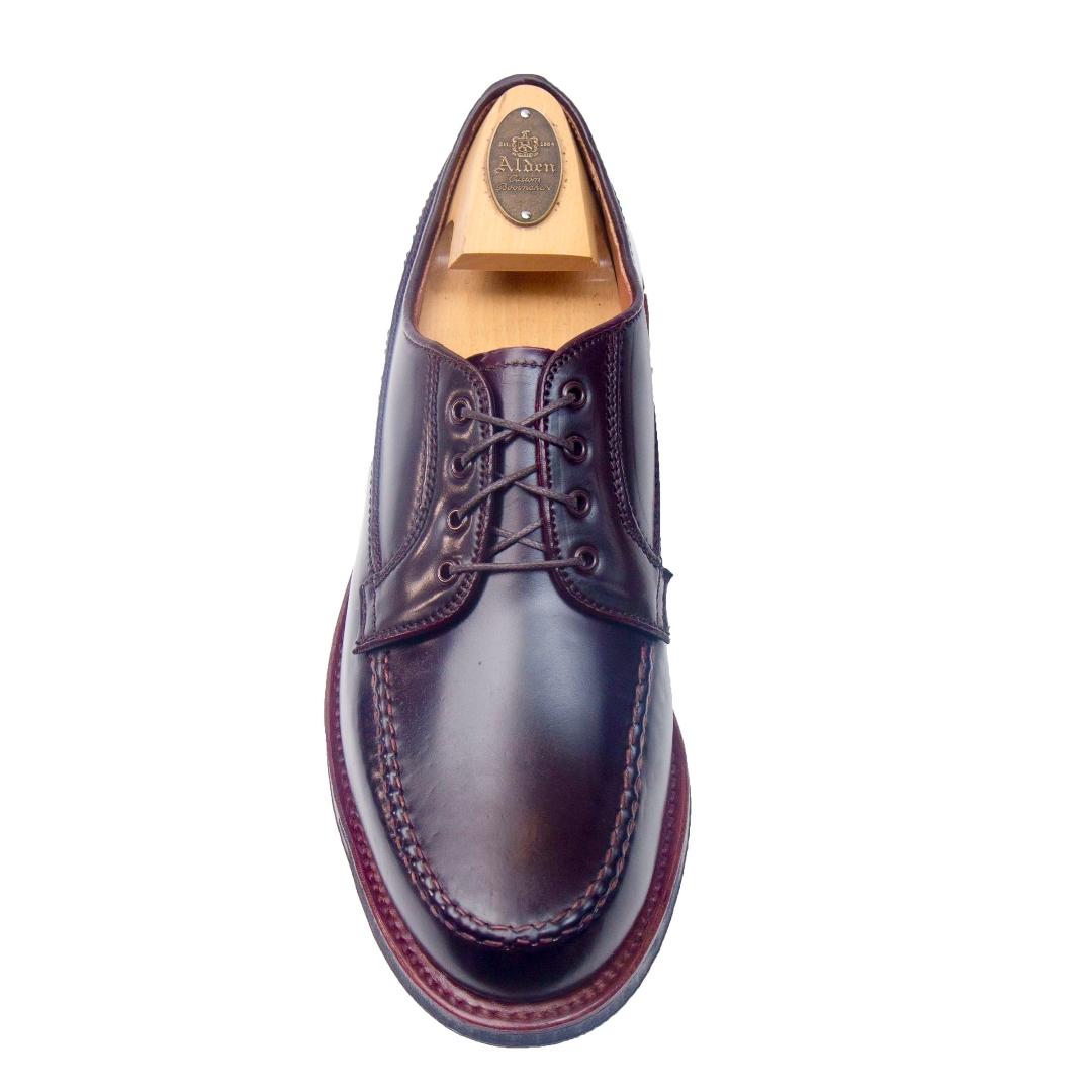 A single Alden Madison D9613C - Ranger Mocc in Color 8 Shell Cordovan, featuring visible stitching, antique edge detailing, and a wooden shoe tree inside, viewed from above on a white background.