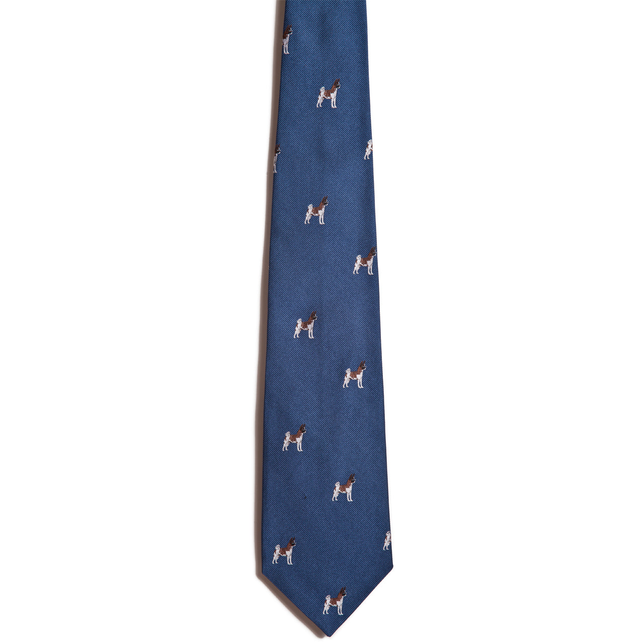 This 100% silk blue necktie by Alden Madison, named Akita, features an enchanting design of small, jacquard-embroidered dogs in various colors artfully arranged throughout.