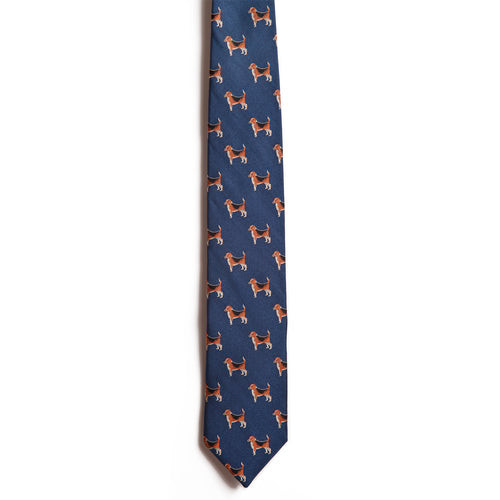 Alden Madisons Beagle: a navy blue silk jacquard necktie with a repeating pattern of small brown beagle dogs facing different directions, shown against a white background.