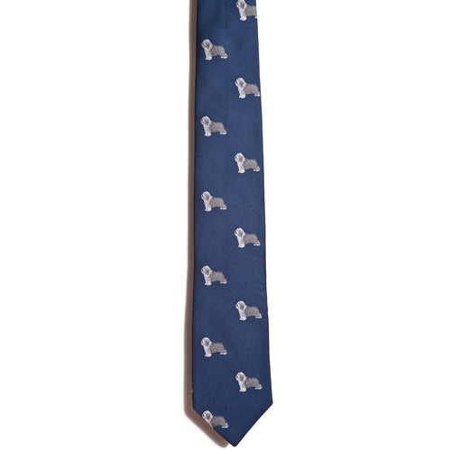 This 100% silk necktie by Alden Madison, named Bearded Collie, features a jacquarding design with charming small white dog illustrations, perfect for enthusiasts.