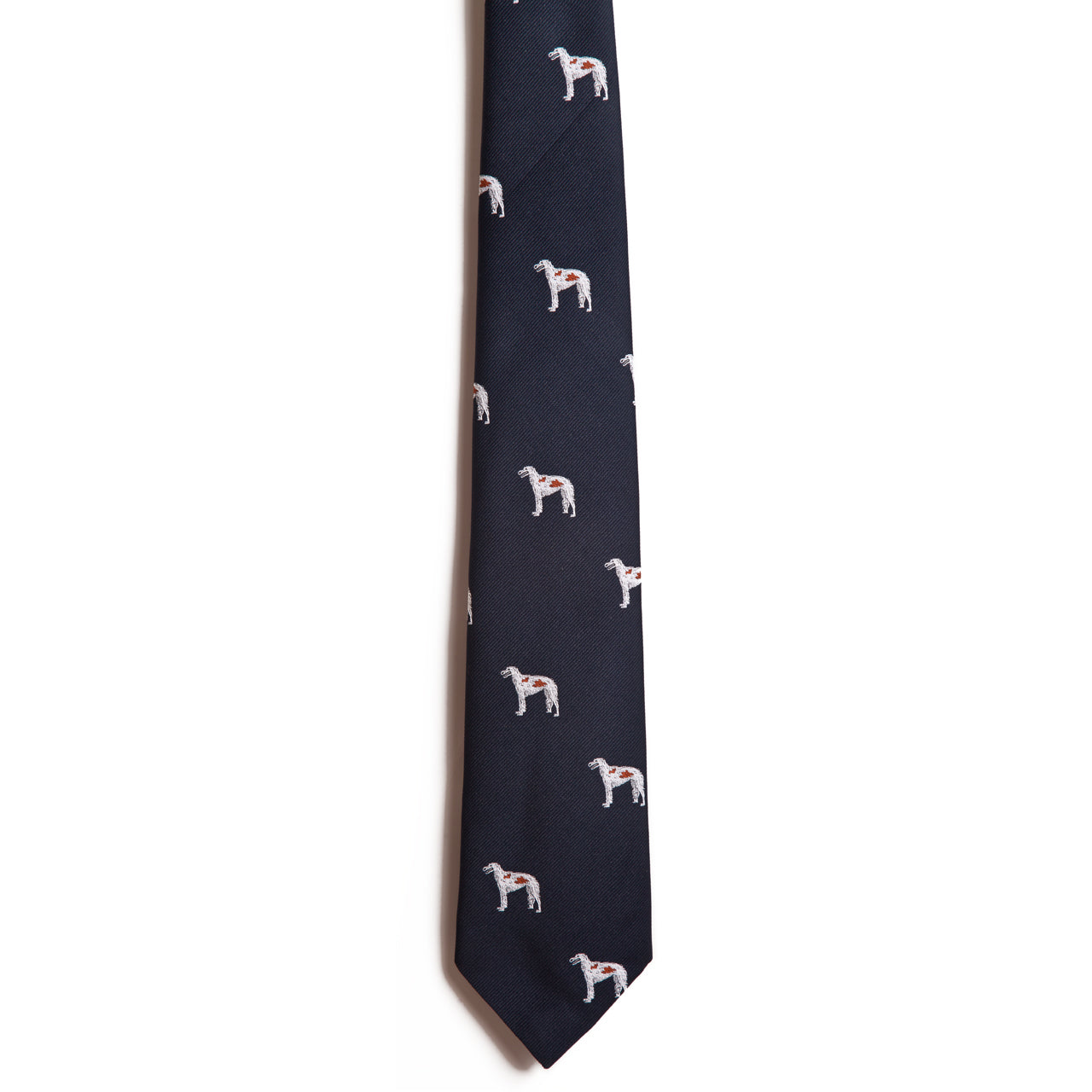 Alden Madisons Borzoi tie in dark blue features a pattern of embroidered white dogs on jacquard fabric. Made from 100% silk, the design is set against a plain white background to accentuate the evenly spaced dogs.