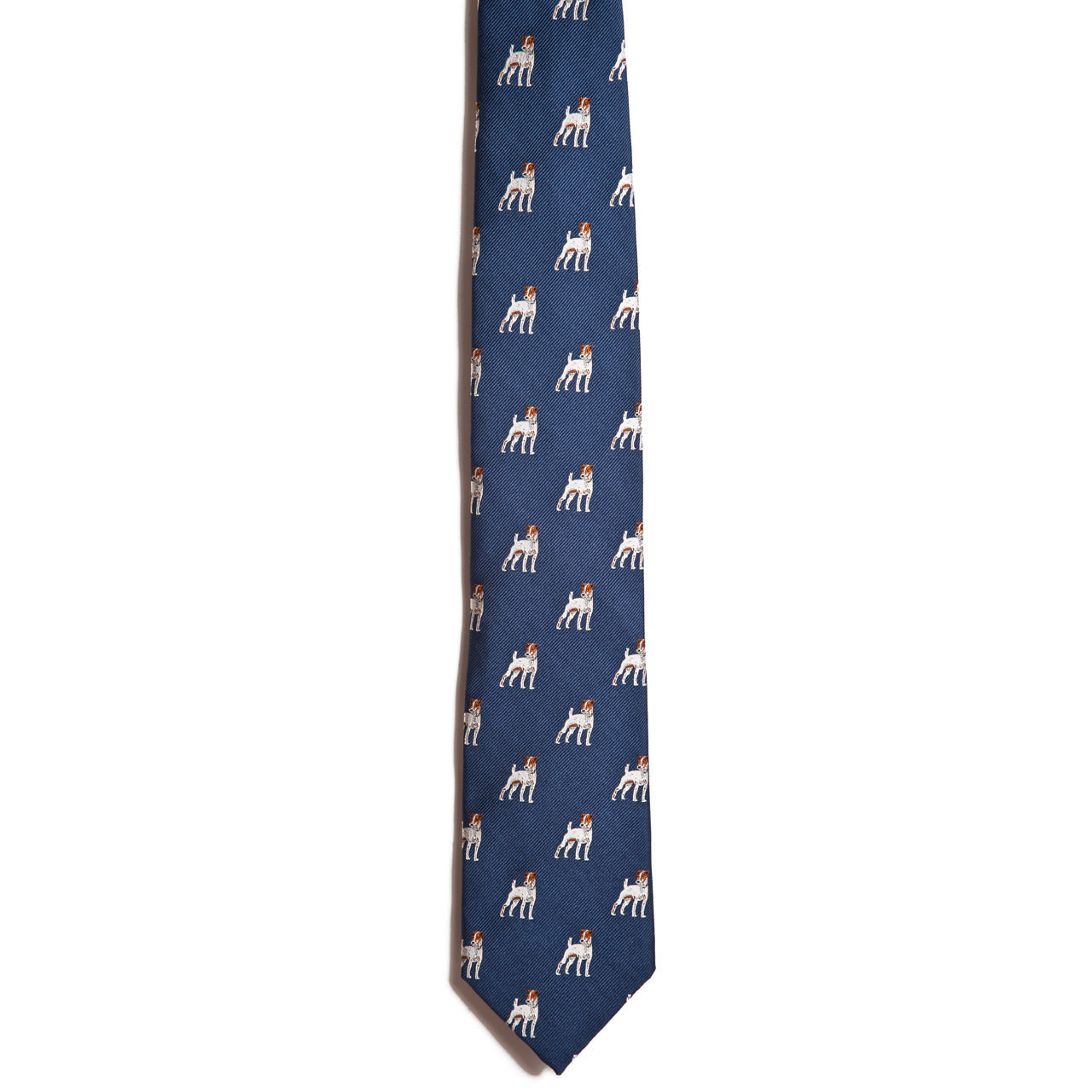A blue silk necktie from Alden Madison features a playful pattern of small Jack Russell Terriers wearing red bows, displayed on a white background.