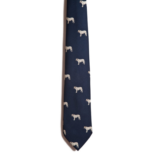 The Alden Madison Mastiff is a navy blue silk jacquard tie featuring small, white embroidered mastiffs—a stylish and unique alternative for those looking to swap out the classic dog breed necktie.