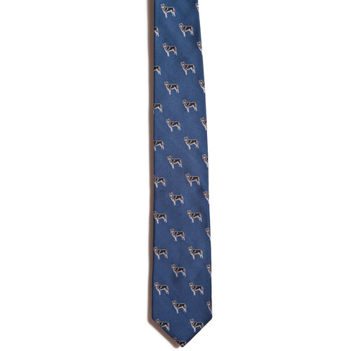 A narrow blue necktie from Alden Madison, made of 100% silk, showcases a jacquard pattern with small white and brown horse illustrations. This Siberian Husky tie adds a sophisticated touch to any outfit with its smooth texture.