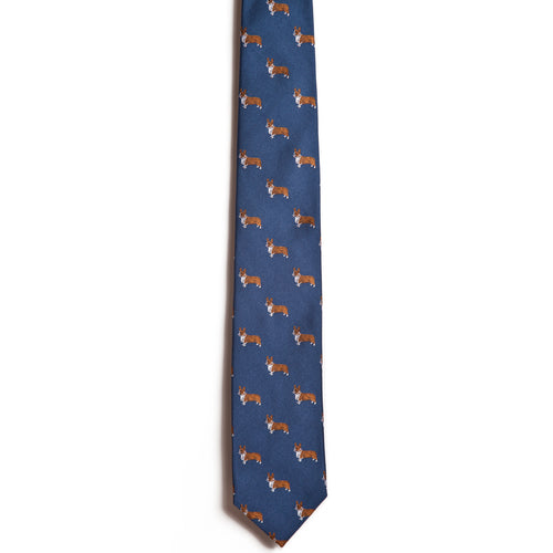 Alden Madisons Welsh Corgi necktie is a dark blue jacquard design adorned with whimsical cartoon-style Corgi dogs in playful poses.