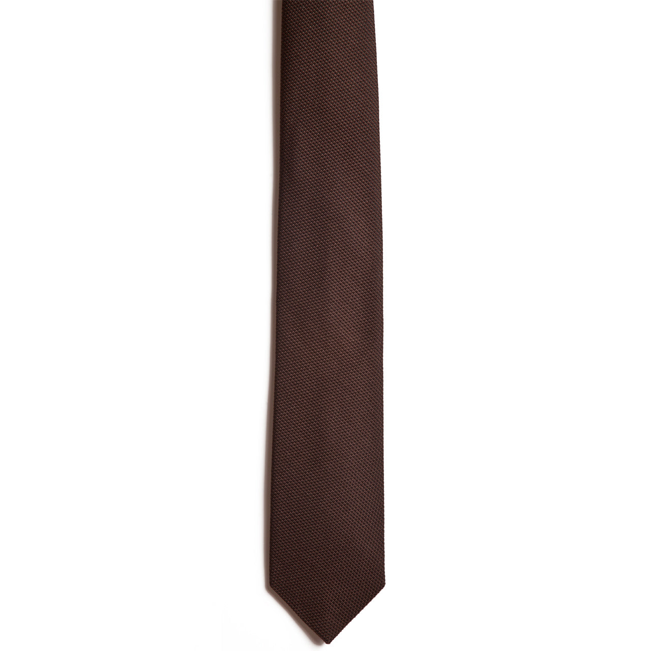 The Chocolate necktie by Alden Madison, made from luxurious Italian silk grenadine, stands out with its brown textured design against a white background.