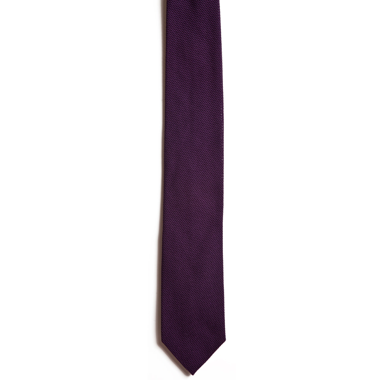 Alden Madisons Purple silk grenadine tie, featuring a solid dark purple hue and subtle textured pattern, is shown against a plain white background.