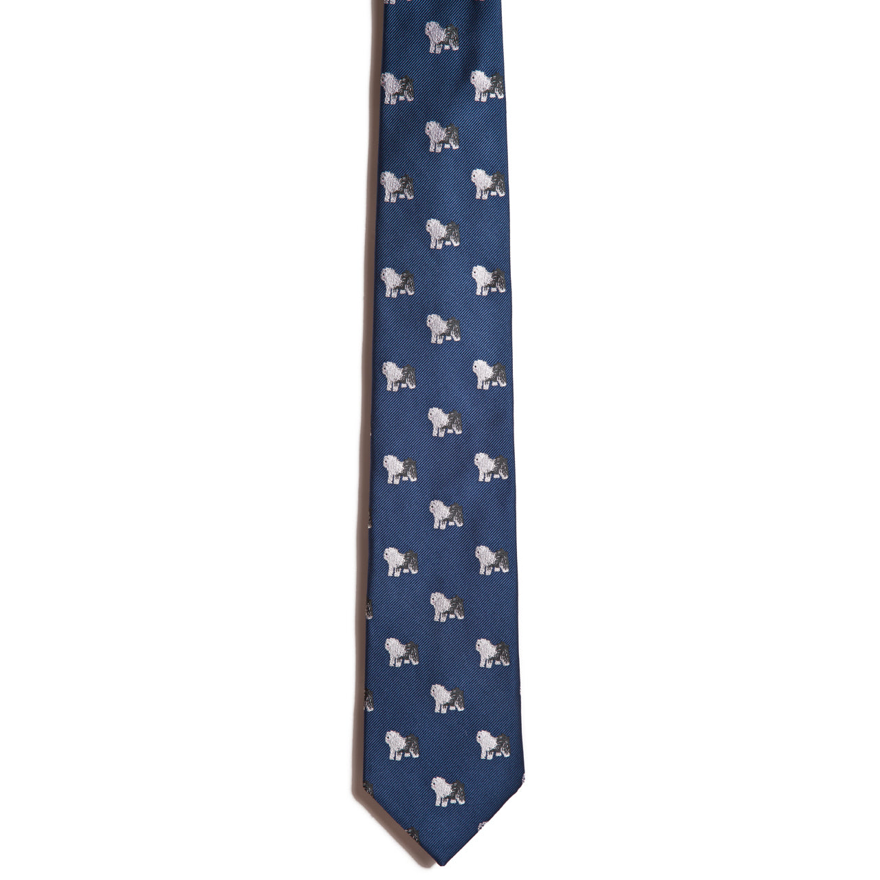 A blue jacquard necktie from Alden Madison featuring a repeating pattern of small white Old English Sheepdog illustrations.