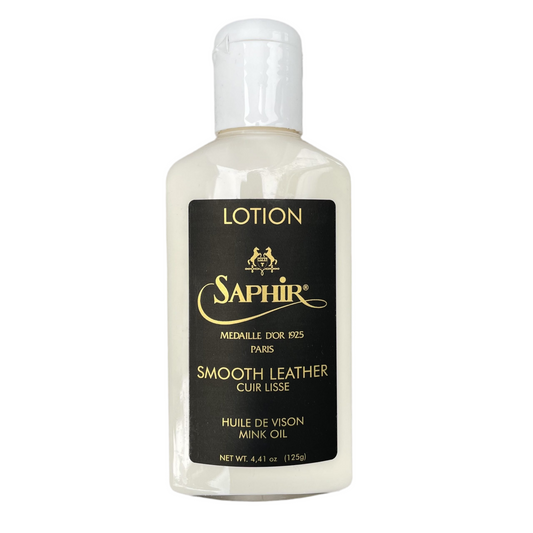 A 4.4 fl oz (125 ml) bottle of Alden Madisons Saphir Leather Lotion / Mink Oil, a premium conditioner for smooth leather. The black label with gold text features branding and product details, enriched for superior care.