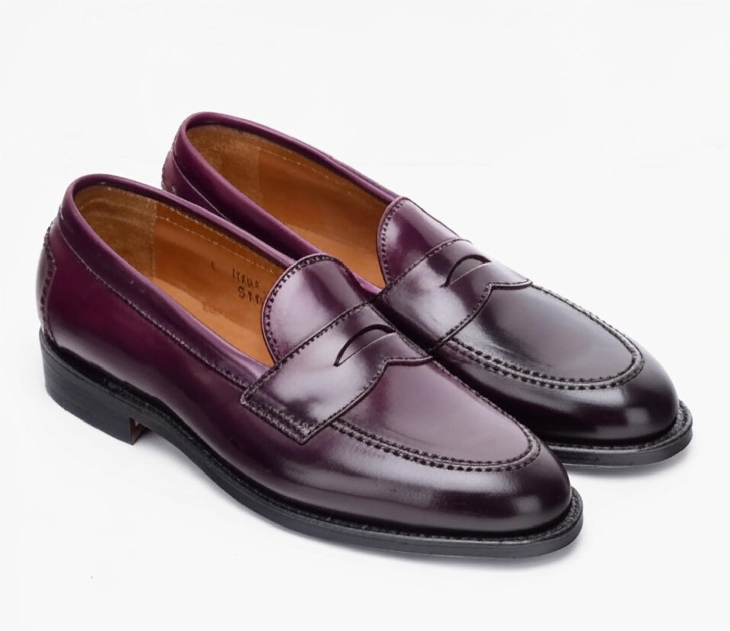 ALDEN SHOES 96948 - Copley Penny Loafer in Color 8 Shell features shiny dark purple leather, black soles, and visible stitching, crafted on the Copley Last and shown against a plain white background.