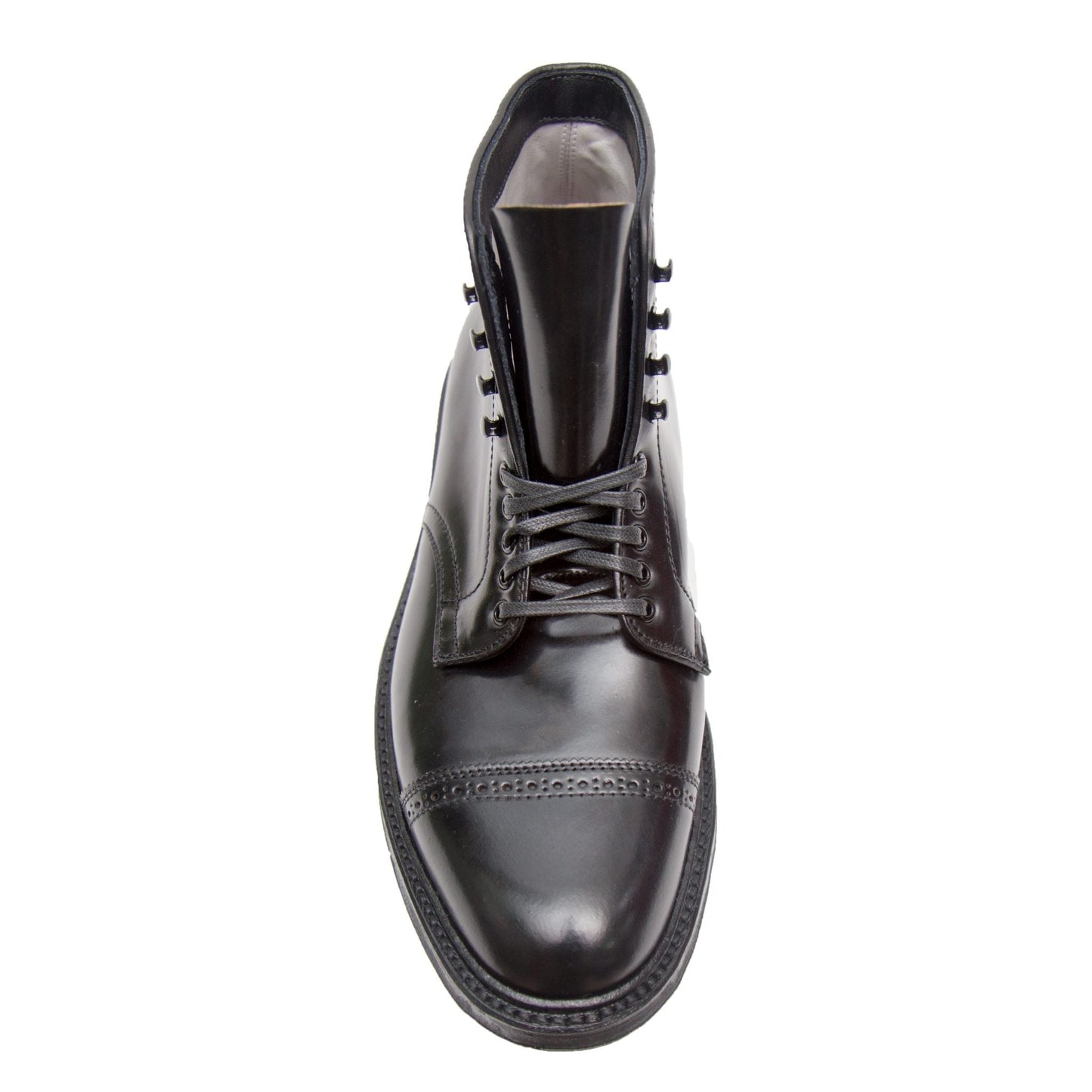 The Alden Madison D7843C - Jumper Boot in Black Shell Cordovan is a black leather dress boot with speed hook lacing, round toe, and decorative stitching on the cap toe and upper. Viewed from above, it showcases a sleek, polished design enhanced by a durable commando sole.