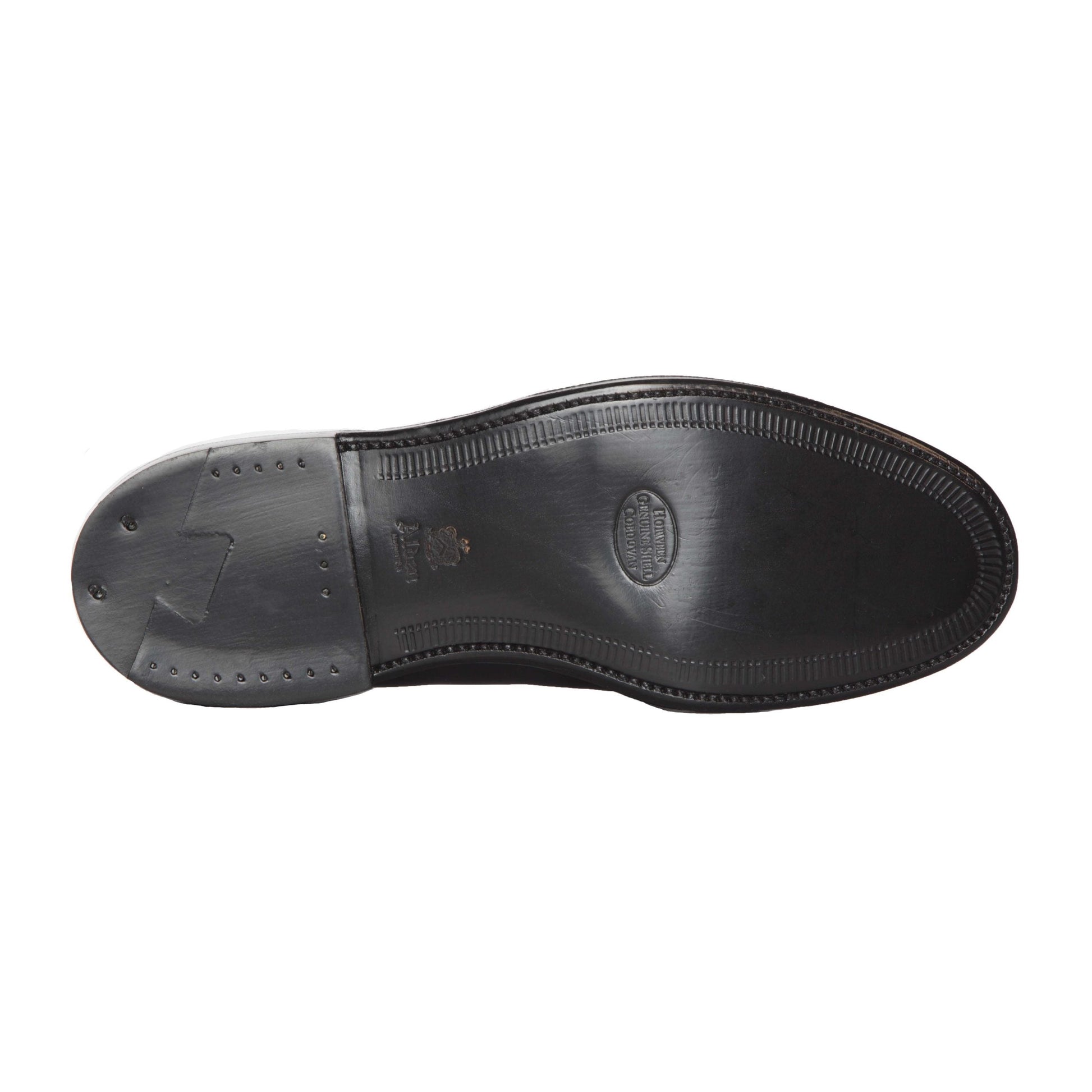 The Alden Madison 67269 - High Vamp Loafer in Black Shell Cordovan features a Single Oak Leather Sole with edge stitching, an oval logo and text at the center, plus small nails near the heel, as seen from the bottom.