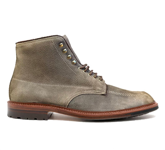 The Alden Madison D3918HC - Clay Nubuck Indy Boot features a classic design, mid-height style in textured gray leather with brown laces and metal eyelets. It includes a Commando sole for enhanced grip, making it perfect for both casual and formal occasions.