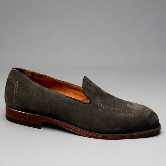 The ALDEN SHOES D5105 - Vanderbilt in Dark Brown Suede is shown against a plain gray background, featuring visible stitching, a low wooden heel, and a tan leather interior on the Aberdeen Last.