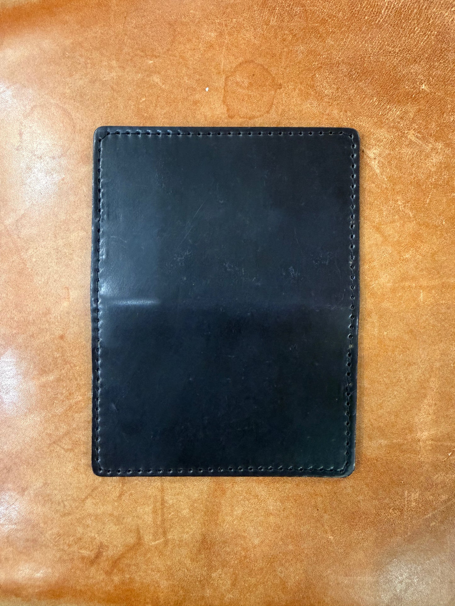 Rectangular black shell cordovan Credit Card Wallet in Shell Cordovan featuring perimeter stitching and four slots.
