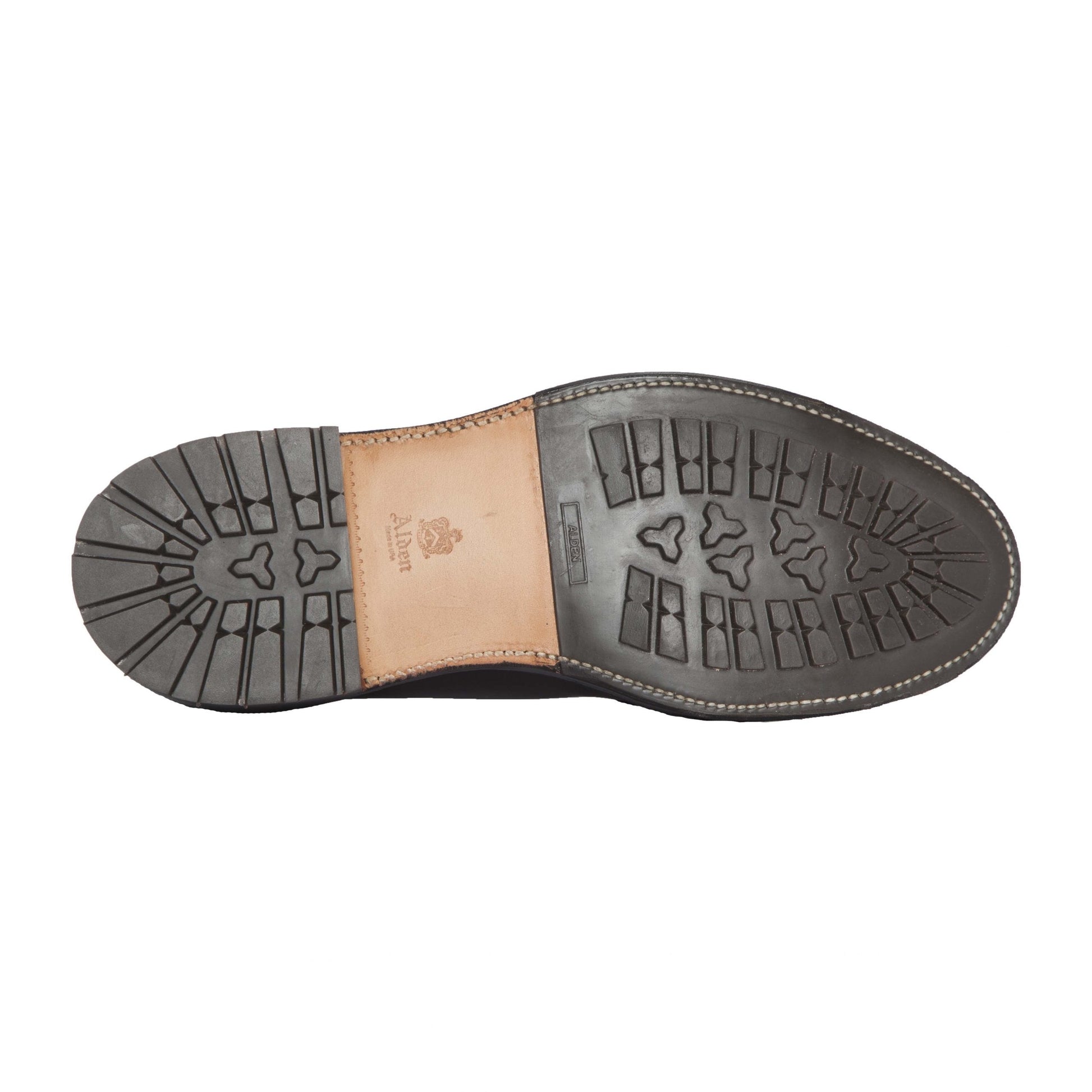 The image shows the sole of Alden Madison’s 13781C Chukka Boot in Brown Chromexcel, featuring a Commando Sole tread pattern with a tan leather section, stamped logo and text, Barrie Last construction, deep grip grooves, and edge stitching.