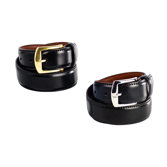 Two Alden Madison 32mm Black Shell Cordovan Belts—one with a brass buckle atop a white cube, the other with a nickel buckle on the surface—are neatly rolled. Both are proudly made in the USA.