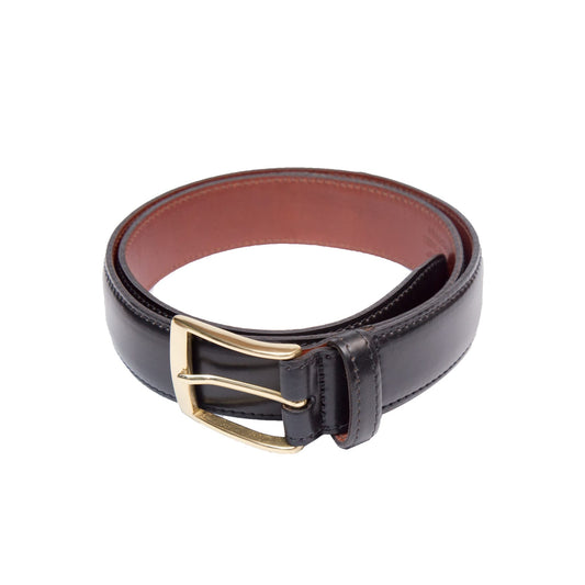 The Alden Madison B502 - Black Shell belt showcases a 35mm gold buckle on black Horween Shell Cordovan leather, contrasted by a dark brown interior, all set against a white background.