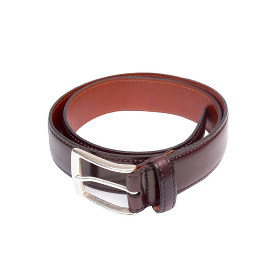 The A501 - Color 8, 35mm belt by Alden Madison, crafted from fine Horween Shell Cordovan, features a coiled dark brown leather design with a sleek silver nickel buckle and is elegantly displayed on a white background.