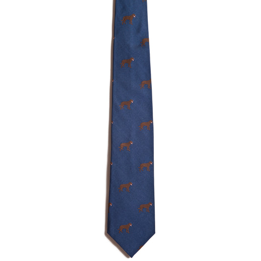 A 100% silk blue necktie from the Alden Madison collection features small brown bear silhouettes and is part of the exclusive Chesapeake Bay Retriever series, elegantly set against a white background.